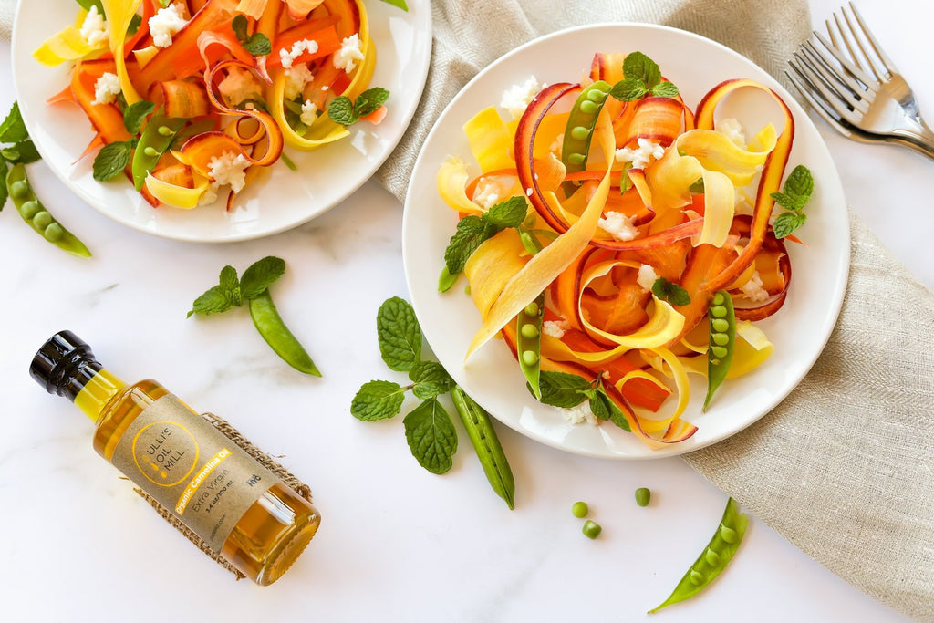 Raw carrot salad with peas and camelina oil