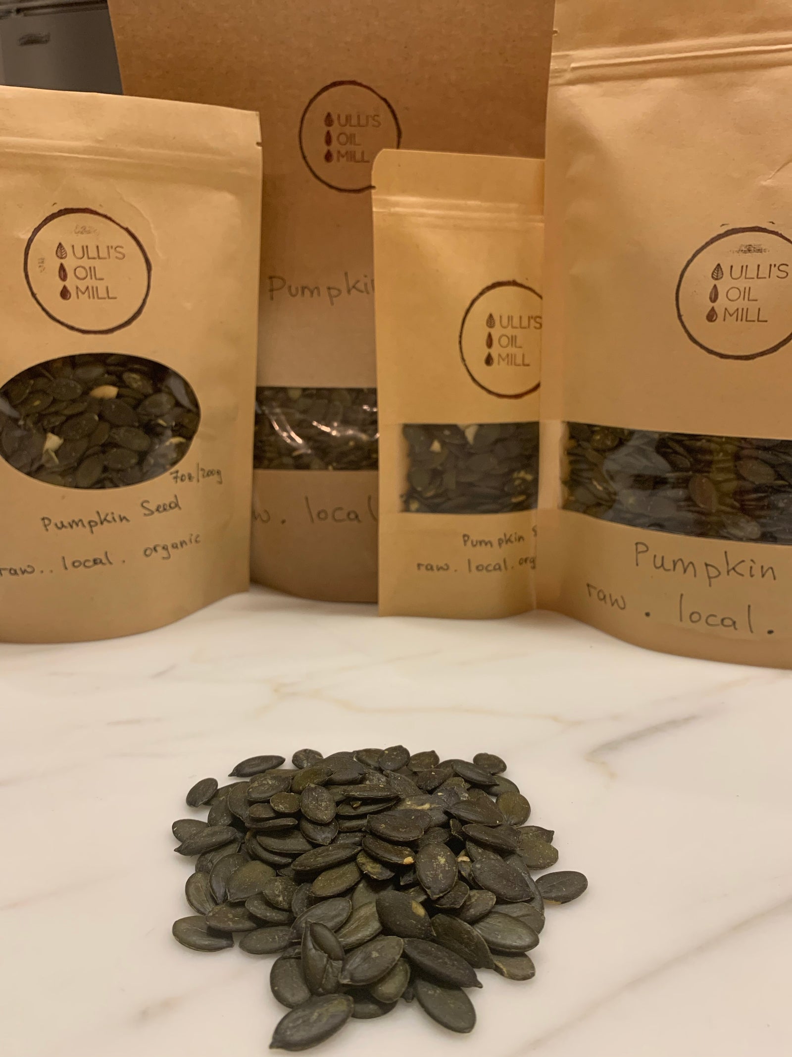 A mound of freshly de-hulled organic pumpkin seeds